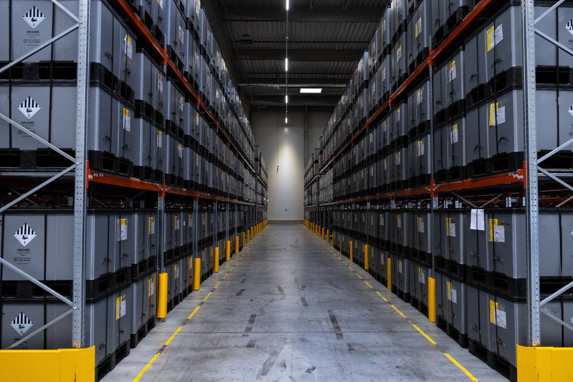 Aisle of stored battery containers in a CHB warehouse